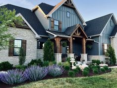 a large house with lots of windows and landscaping