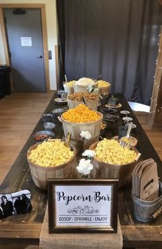 a buffet table filled with lots of different types of snacks and desserts on it