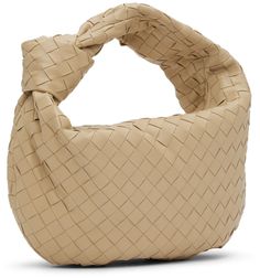 Intrecciato-woven grained lambskin shoulder bag in beige. · Integrated carry handle with knotted detailing · Zip closure · Calfskin lining · Gold-tone hardware · H12 x W15 x D4 in Supplier color: Porridge/Gold Beige Leather Bags With Interwoven Design, Designer Beige Shoulder Bag With Rolled Handles, Evening Bag With Intrecciato Weave In Beige, Designer Beige Bags With Intrecciato Weave, Beige Evening Bags With Intrecciato Weave, Beige Intrecciato Weave Evening Bag, Luxury Cream Shoulder Bag With Intrecciato Weave, Luxury Beige Shoulder Bag With Intrecciato Weave, Designer Beige Shoulder Bag With Intrecciato Weave