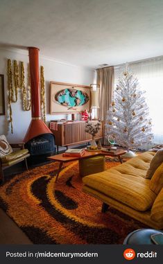 a living room filled with furniture and a christmas tree