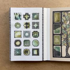 an open book with different designs on the pages and in front of it is a drawing of a tree