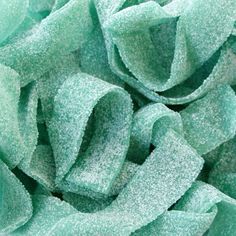 close up view of green fabric textured with frosty powdered material, background or wallpaper