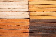 several different colors of wood stacked on top of each other