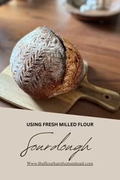 a loaf of bread sitting on top of a cutting board