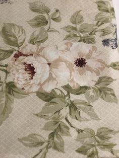 an image of a flowered fabric with green leaves and flowers on the bottom half