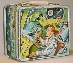 an old tin lunch box with two men in space on the front and one man sitting at the back