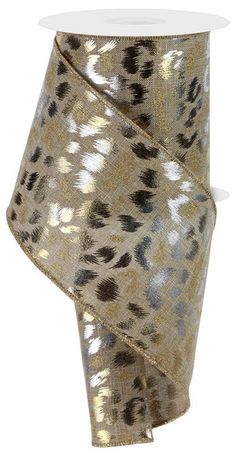 a roll of metallic foiled ribbon with leopard print on the front and back side