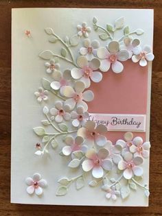 a birthday card with paper flowers on it