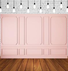 an empty room with pink walls and wooden floors, surrounded by hanging lightbulbs