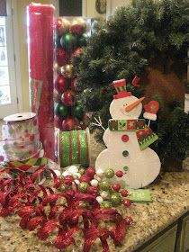 a kitchen counter topped with lots of christmas decorations