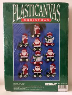 the plastic canvas christmas decorations are shown in red and white santas on green wheels