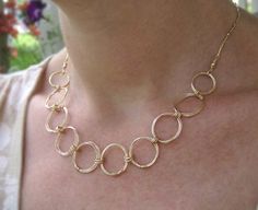 "Gold Circles Necklace ~ Modern and minimal, delicate coiled circles of 14k gold filled wire are linked together to create a flowing large link chain embellished with wire wrapped gold beads and finished with a lobster clasp and extender chain ending with a gold drop.  You can also choose a magnetic clasp option for simple on and off. The coiled rings are 3/4\" diameter. The lobster clasp version is adjustable length. Whichever length you choose will include an additional 1 1/2\" extender chain. Karma Jewelry, Open Circle Necklace, Necklace Infinity, Gold Circle Necklace, Gold Bracelet Set, Green Beaded Necklace, Nugget Necklace, Circle Bracelet, Rings Necklace