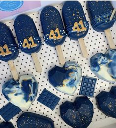 blue and white popsicles with gold numbers on them