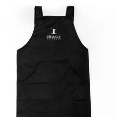 an apron with the i image logo on it, sitting against a white background in front of