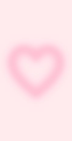 a heart shaped object on a pink background