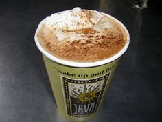 a cup of coffee with whipped cream on top