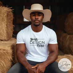 Introducing our Western Cowboy Fall T-shirt Mockup! A perfect mockup for your rodeo, desert, landscape, rustic, wild west designs. Our mockup is ideal for Gildan 64000, Bella 3001, Comfort Colors 1717, and universal brands.   Discover the perfect blend of Western and Fall styles with this white t-shirt mockup, featuring a stunning male model  on ranch location. Take your shop to the next level featuring high quality, aesthetic mockups. Designs by Azucar has a variety of designs, models, and occa White Crew Neck Tops For Western-themed Events, Western Tshirt, Quality Aesthetic, Fall White, American Model, Fall Styles, Clothing Mockup, Desert Landscape, Autumn Vibes