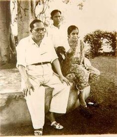 an old black and white photo of three people