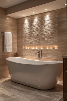 a large white bath tub sitting inside of a bathroom