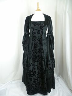 This listing is for a custom made dress,it will be made to the measurements you send me. Please send me your bust,waist and hip measurements,and please measure from the top of your shoulder to the floor with shoes on. It will be made with beautiful jet black crushed velvet and stunning black flocked taffeta....this fabric will also line the inner sleeves.It has a corset style front and back with lacing so you can adjust the dress to fit your body shape. Combined shipping on multiple items. If you purchase express shipping by courier please send me your phone number thank you. Fitted Ball Gown With Corset Back For Banquet, Black Fitted Gown With Boned Bodice, Fitted Black Gown With Boned Bodice, Elegant Fitted Ball Gown With Overbust, Fitted Ball Gown Corset Dress For Banquet, Elegant Fitted Overbust Ball Gown, Elegant Overbust Fitted Ball Gown, Fitted Empire Waist Gown For Banquet, Fitted Gothic Ball Gown