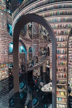 the inside of a library with many books on shelves