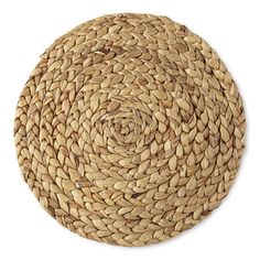 a round woven placemat on a white background