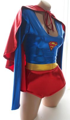 a female mannequin wearing a blue and red superman suit with cape on top