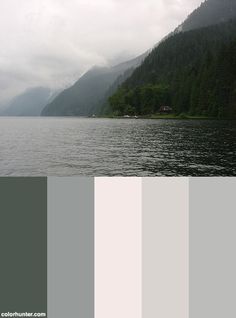 a lake with mountains in the background and gray skies above it, along with some green trees