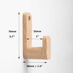 a wooden hook is shown with measurements for it