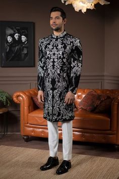 Black full sleeves band collar sherwani with all over Wildflower bloom embroidery. Paired with a trouser. - Aza Fashions Traditional Black Sherwani With Floral Embroidery, Embroidered Long Sleeve Semi-formal Sherwani, Black Long Sleeve Sherwani With Intricate Embroidery, Black Embellished Sherwani With Long Sleeves, Black Embroidered Semi-stitched Sherwani, Jayanti Reddy, Trouser Pattern, Rohit Bal, Tarun Tahiliani