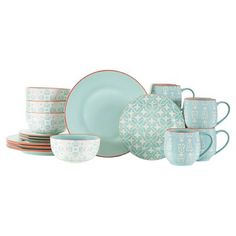 a set of dinnerware with blue and white designs