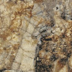 a close up view of the surface of a marble slab with brown and white colors