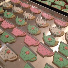 some decorated cookies are sitting on a tray