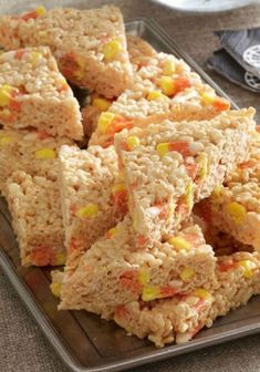 rice krispy treats stacked on top of each other with candy corn in the middle