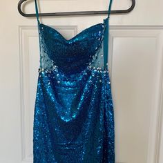 This Beautiful Dress Can Be Worn As A Weeding Guest Or Any Special Occasion. New Without Tags. Size Medium Blue Strapless Sequin Evening Dress, Glamorous Blue Strapless Sequin Dress, Blue Strapless Sequin Dress For Evening, Blue Strapless Sequin Dress, Glamorous Style, Blue Strapless Sequin Dress For Prom, Blue Fitted Strapless Sequin Dress, Blue Sleeveless Dresses With Contrast Sequin, Blue Sleeveless Dress With Contrast Sequin, Blue Evening Dress With Contrast Sequin For Party Season