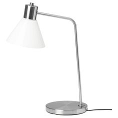 a lamp that is on top of a metal stand with a white light in front of it