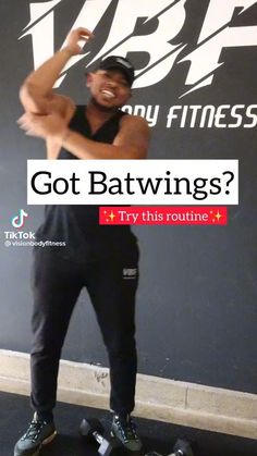 a man standing in front of a wall with the words got batwings? try this routine