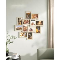 a living room with pictures hanging on the wall and a coffee table in front of it