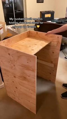 a wooden desk sitting on top of a hard wood floor