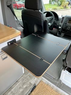 there is a table in the back of this vehicle that has been placed on the floor