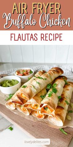 an air fryer buffalo chicken flauas recipe on a cutting board with guacamole and salsa