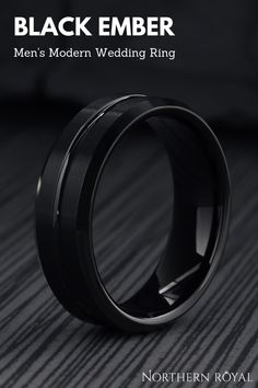 a black ring with the words, men's modern wedding ring