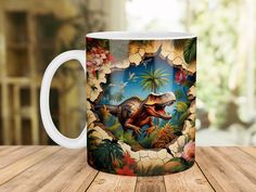 a coffee mug with an image of a dinosaur in the middle of it on a wooden table