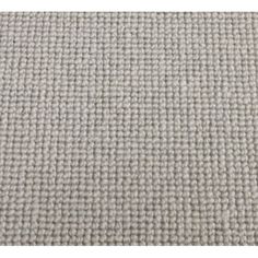 an upholstered gray carpet with some white dots on the top and bottom half