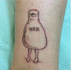 a person with a tattoo on their leg that says ham