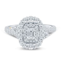 an emerald cut diamond ring set in 18k white gold with diamonds around the band