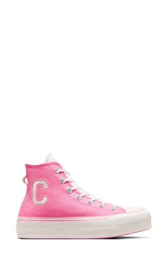 Varsity style embroidery give a charming finish to a high-top canvas sneaker with a signature lace-to-toe design and platform sole. Textile upper and lining/rubber sole Imported Trendy Converse Canvas Shoes In Cotton, Converse Cotton Lace-up Platform Sneakers, Pink High-top Textile Sneakers, Pink Mid-top Canvas Sneakers, Pink Canvas High-top Sneakers For Spring, Trendy Converse Canvas Sneakers, Sporty Cotton Canvas Shoes With Embroidered Logo, Pink Canvas High-top Sneakers With Round Toe, Pink Canvas High-top Sneakers Sporty Style