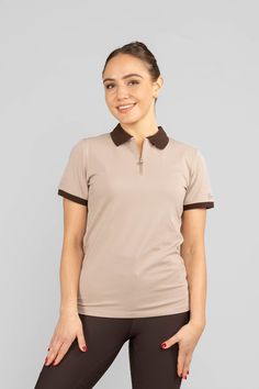 Pebbles Polo Shirt is designed by Anna and Emma Elfstrand.

The polo shirt is made from a comfortable functional material with stretch and features a ZacZess logo at the left sleeve cuff. The half-zip zipper has ZacZess's classic Z as the puller. Beige with brown details like collar and sleeve cuffs.

The material absorbs and wicks away sweat and excess heat from your body, keeping you dry throughout your ride.

Product details:


	71.3% Cotton, 25.6% Polyester, & 3.1% Spandex.
	Size 2XS-2XL.
	L Sleeve Cuff, Wicks, Half Zip, Polo Shirt, Spandex, Zipper, ? Logo