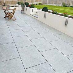 an outdoor patio with table and chairs