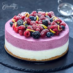 there is a cake with berries on it